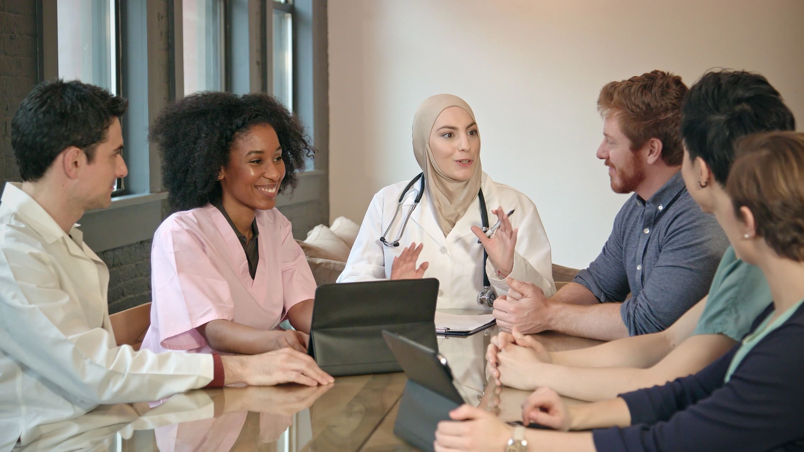 Healthcare professionals meeting to discuss care strategy
